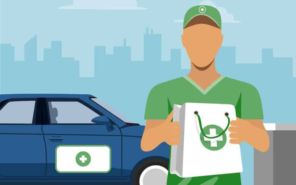 A delivery person holding a bag of cannabis. A delivery car is in the background.