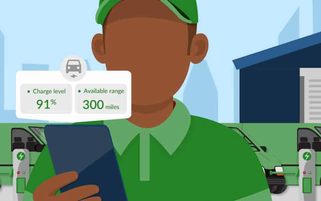 A driver in green looking at charging statistics for an electric vehicle.