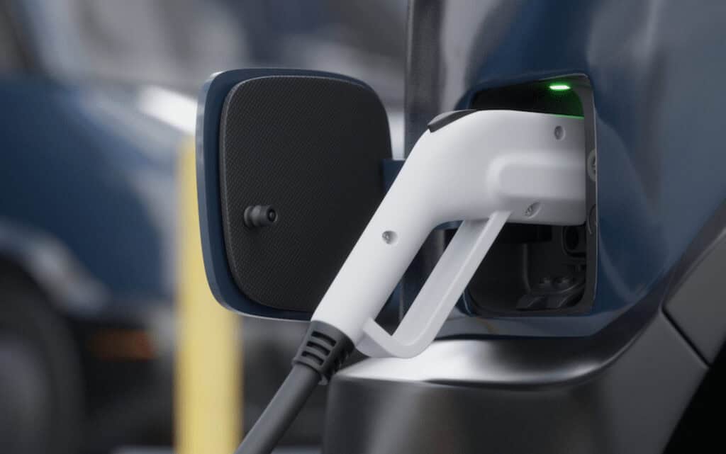 Close-up of a charging cable plugged in to an EV.
