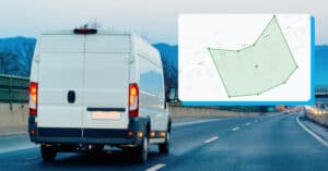 Vehicle towing trailer on highway with GPS navigation overlay