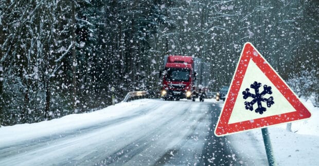Snow-covered mountain road with icy conditions illustrating the most dangerous winter roads for drivers