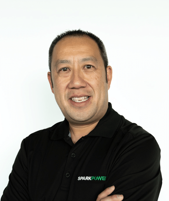 a business owner smiling and looking at the camera